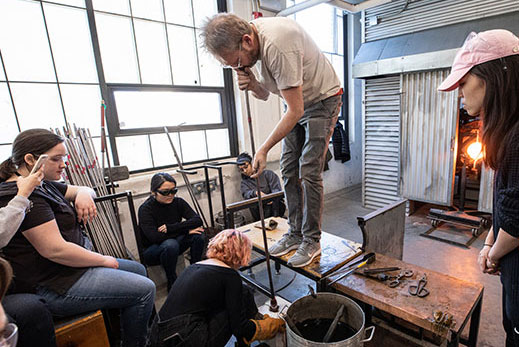 Teacher demonstrating glassblowing techniques. Links to Gifts of Appreciated Securities Teacher demonstrating glassblowing techniques. Links to Gifts of Appreciated Securities